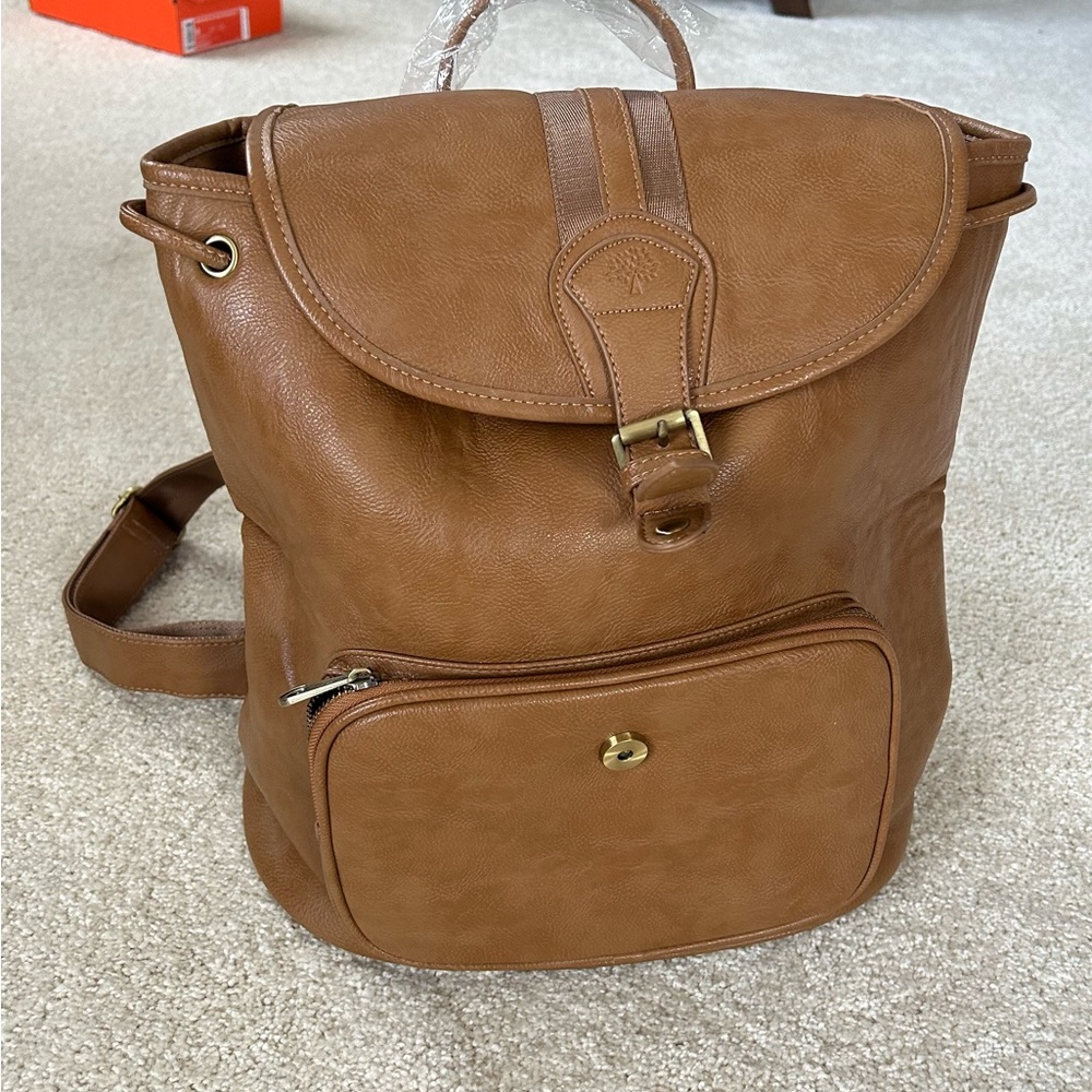 Caramel in color - very soft and spacious backpack